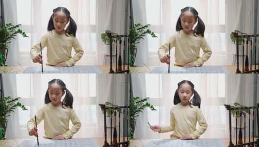 练习毛笔字的亚洲女孩高清在线视频素材下载