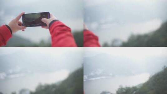 女性在对着山拍照高清在线视频素材下载