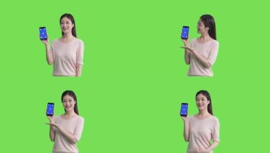 精品 · 女生手拿蓝屏手机展示动作绿幕抠像高清在线视频素材下载