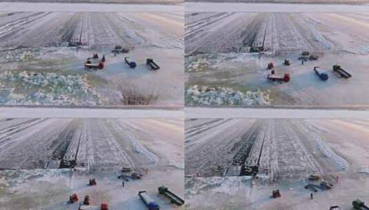 中国黑龙江哈尔滨冰雪大世界采冰航拍高清在线视频素材下载