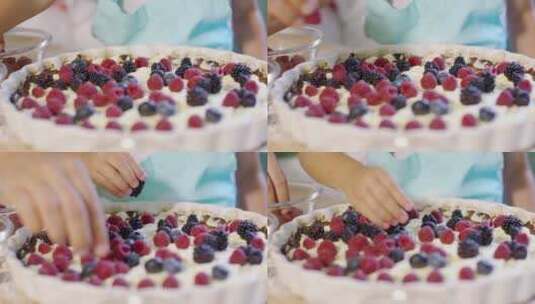 小女孩用水果点缀蛋糕高清在线视频素材下载