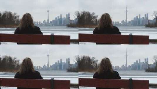 坐在椅子上俯瞰城市风景的女人高清在线视频素材下载