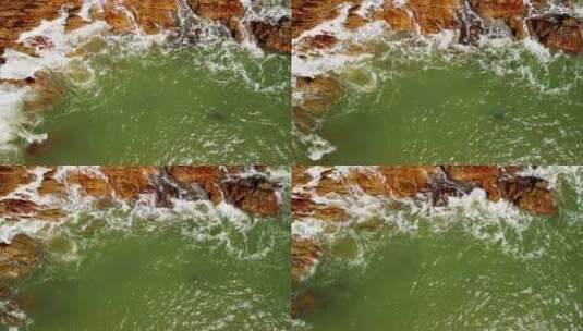 蓝色海浪拍打着海边礁石高清在线视频素材下载
