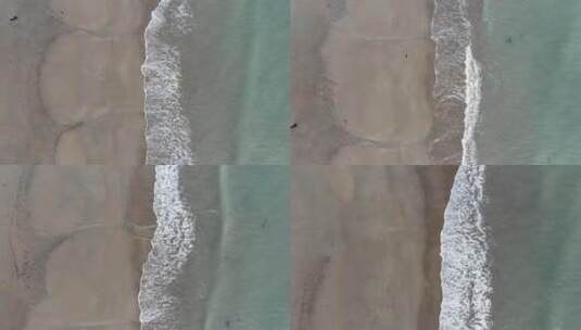 航拍俯视海边沙滩海水浪花波浪自然风景高清在线视频素材下载