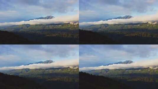 太阳斜照在云雾缭绕的高山上高清在线视频素材下载