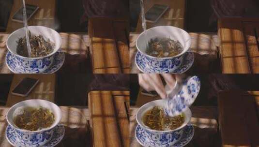 特写用开水冲泡盖碗中的茶叶高清在线视频素材下载