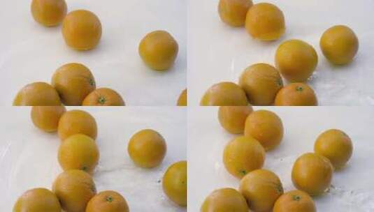 白色背景下水中橙子的SLOMO高清在线视频素材下载