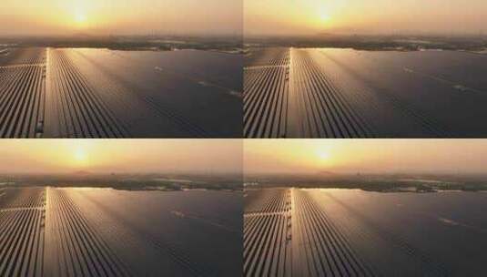 夕阳下水上太阳能光伏发电站航拍高清在线视频素材下载