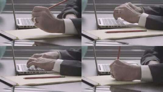 左撇子高管在办公桌上的笔记本电脑上做笔记和打字，但仍然被枪杀高清在线视频素材下载