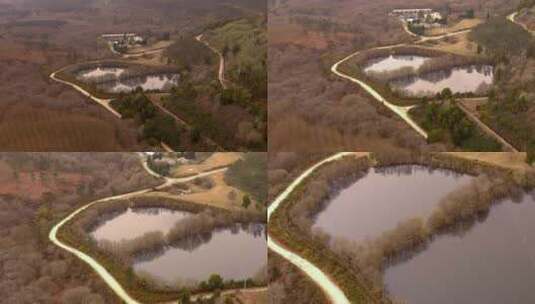 在Encoro de Villasenin附近有两个水库的林地景观上空。Dolly Forward，Tilt Do高清在线视频素材下载