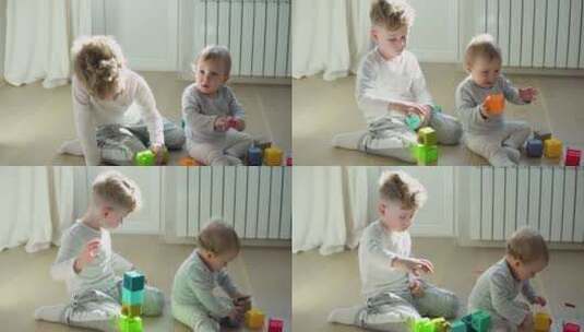 两个孩子玩彩色玩具积木高清在线视频素材下载