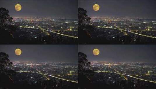 山顶上中秋赏月城市上空月亮升起十五的月亮高清在线视频素材下载