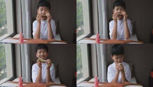 可爱的小男孩吃西瓜高清在线视频素材下载