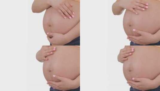 孕妇妈妈抚摸肚子高清在线视频素材下载