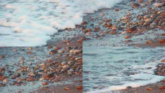 海浪冲刷岸边的鹅卵石高清在线视频素材下载