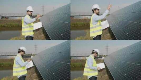 检查太阳能电池板的男工程师高清在线视频素材下载