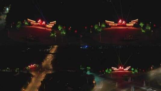航拍江西永新县高速出入口“永新”雕塑夜景高清在线视频素材下载
