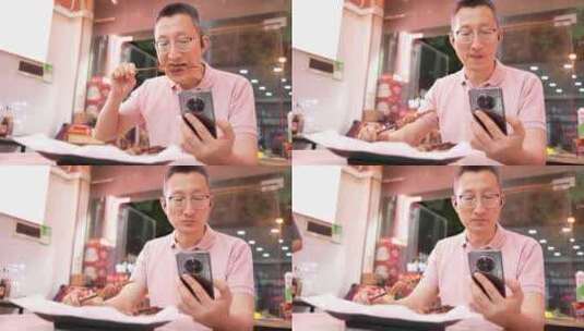 男子在烧烤店吃羊肉串高清在线视频素材下载