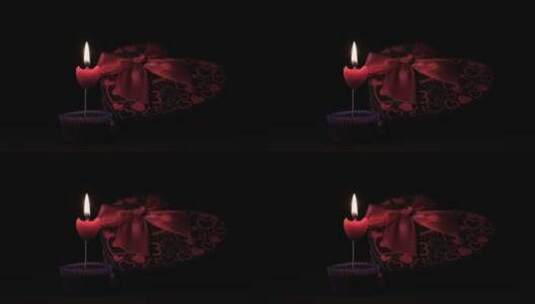 爱心礼盒和点燃的爱心蜡烛高清在线视频素材下载