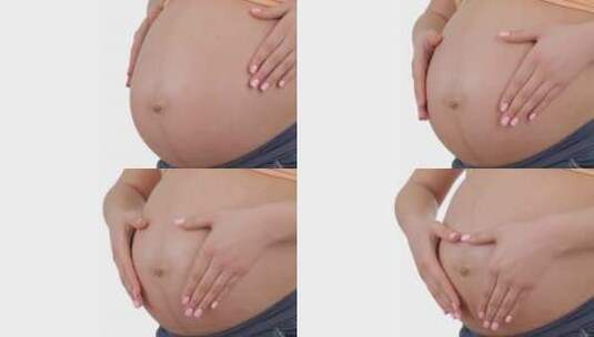 孕妇妈妈抚摸肚子高清在线视频素材下载