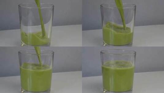 在小玻璃杯里倒入亮绿色抹茶高清在线视频素材下载