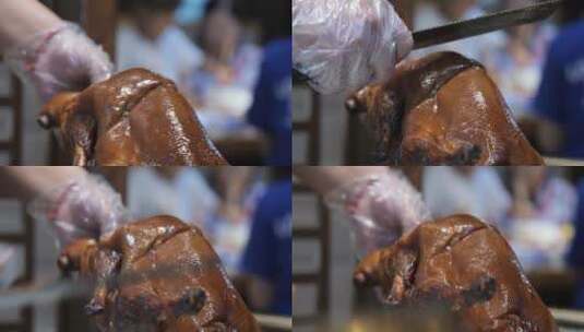 厨师正在用刀片烤鸭鸭肉高清在线视频素材下载