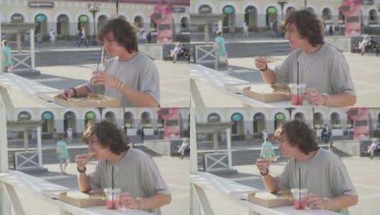 站在户外桌子旁吃披萨喝饮料的男人高清在线视频素材下载