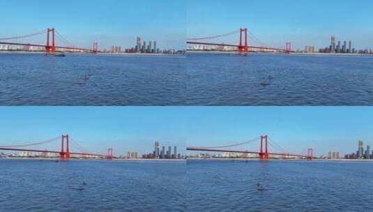 航拍长江江景中航行的帆板运动健身的男人高清在线视频素材下载