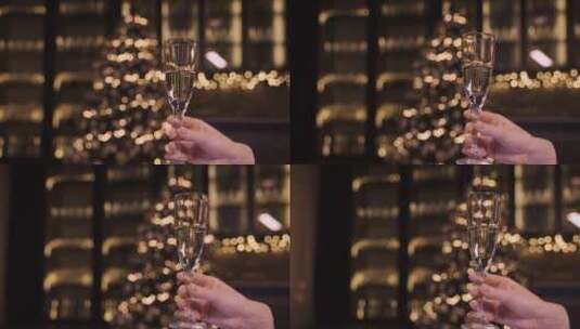女人端起香槟杯庆祝圣诞节高清在线视频素材下载