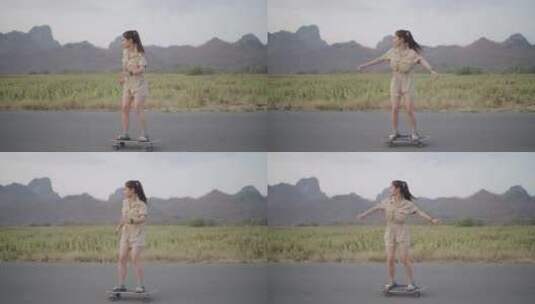 女子道路上玩滑板高清在线视频素材下载