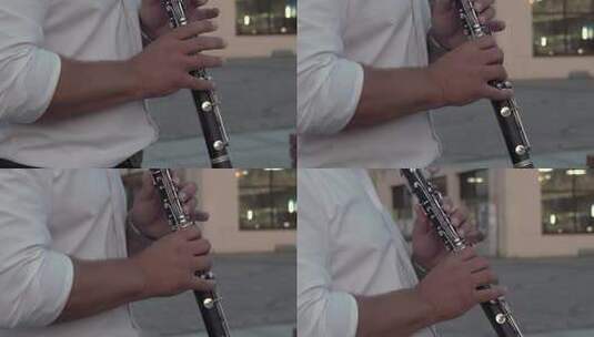 音乐家在街头演奏单簧管特写镜头高清在线视频素材下载