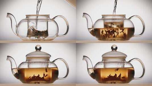 特写用开水冲泡透明茶壶中的茶叶高清在线视频素材下载