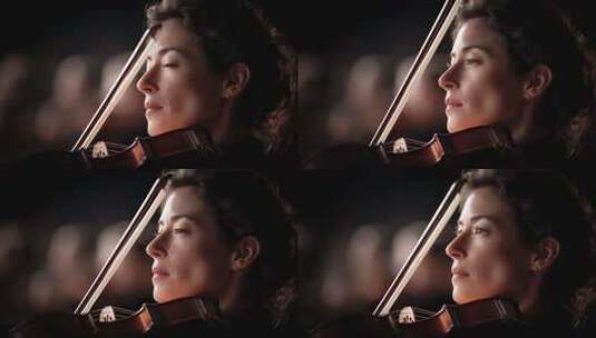 专注演奏小提琴的优雅女性高清在线视频素材下载