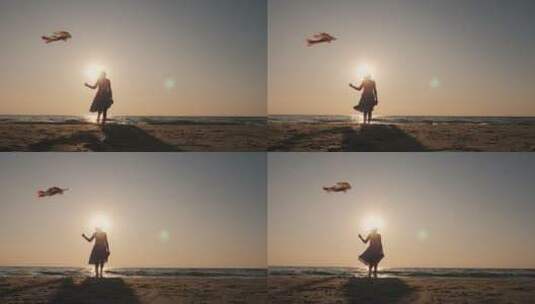 妈妈走在海水里放风筝高清在线视频素材下载