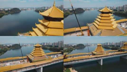 广西柳州凤凰岭大桥建设中风雨亭金色塔顶高清在线视频素材下载