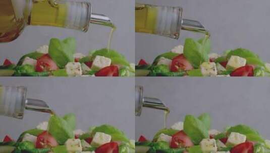 在新鲜健康沙拉上淋上橄榄油高清在线视频素材下载