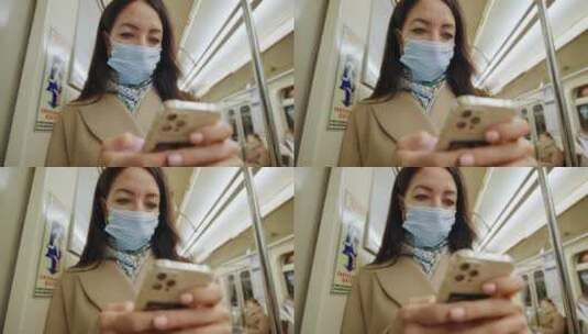 女人在地铁上玩手机高清在线视频素材下载