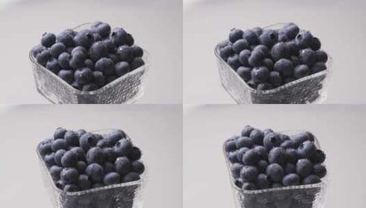 旋转玻璃碗中蓝莓高清在线视频素材下载