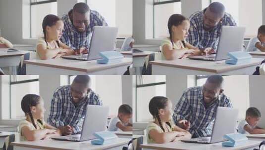 快乐的非裔美国男老师用笔记本电脑帮助高加索女孩的视频高清在线视频素材下载