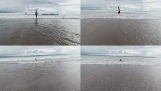 多云晴天巴厘岛海滩东南亚人欢乐海浪奔跑高清在线视频素材下载