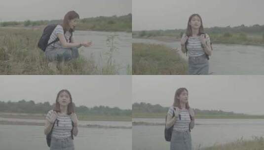 女孩乡村河边玩水欣赏田间风景灰片高清在线视频素材下载