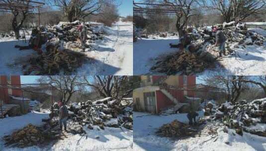 在雪地上清理木头的男人高清在线视频素材下载