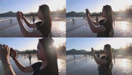 美女用手机在海边拍照高清在线视频素材下载