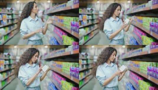 年轻的西班牙裔女性在超市或商店选择个人护高清在线视频素材下载