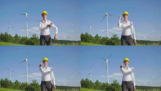 工程师控制风力涡轮机的运行，风力涡轮机依高清在线视频素材下载