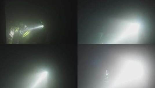 消防员在黑暗的大楼里用手电筒四处走动高清在线视频素材下载