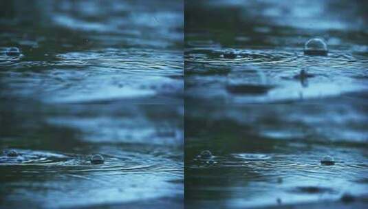 阴沉天气下雨天雨滴落下冒泡特写高清在线视频素材下载