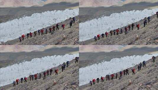 航拍攀登慕士塔格峰冰川冰塔林旁的登山队高清在线视频素材下载