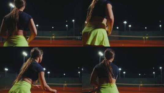 夜间锻炼和训练中专业女选手在球场上的网球高清在线视频素材下载