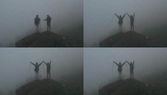 徒步的人站在高山石头上战胜困难登顶高清在线视频素材下载
